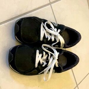 These new balance shoes are never worn and are size six in a black color